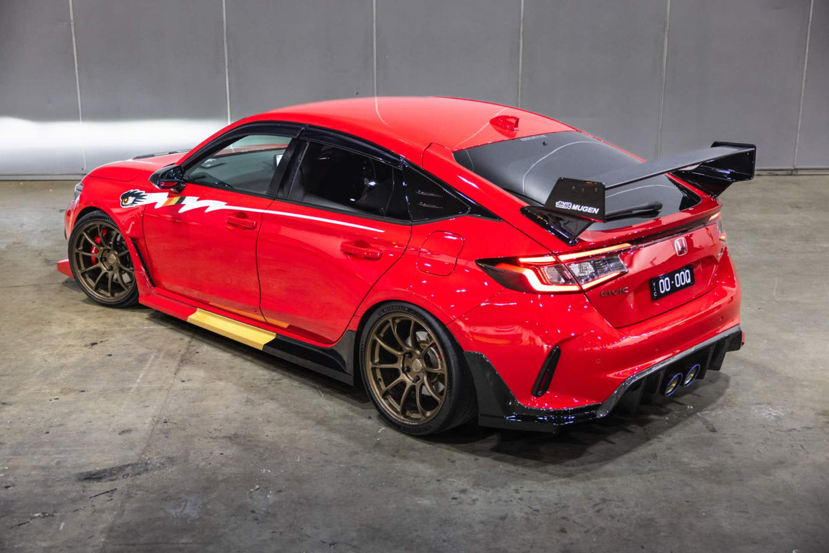 Rear three quarter view of an FL5 Civic Type R showing the side graphic decal running the length of both doors