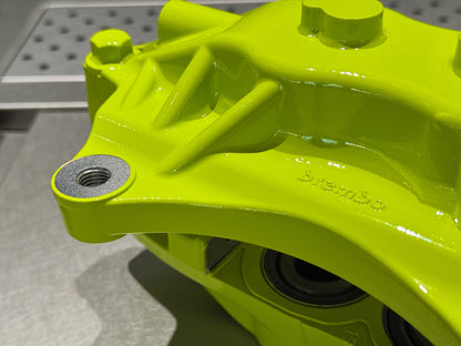 Close up of the caliper mounting boss and bleed port after rebuild