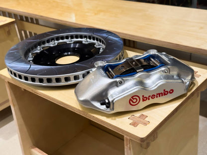 330mm two piece slotted disc beside rebuilt Brembo F50 caliper, Honda NSX NA1 NA2 and S2000 AP1 AP2 brake kit