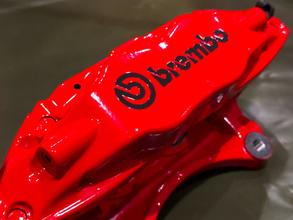 Three quarter view of a red Brembo F50 caliper for Subaru WRX and STI