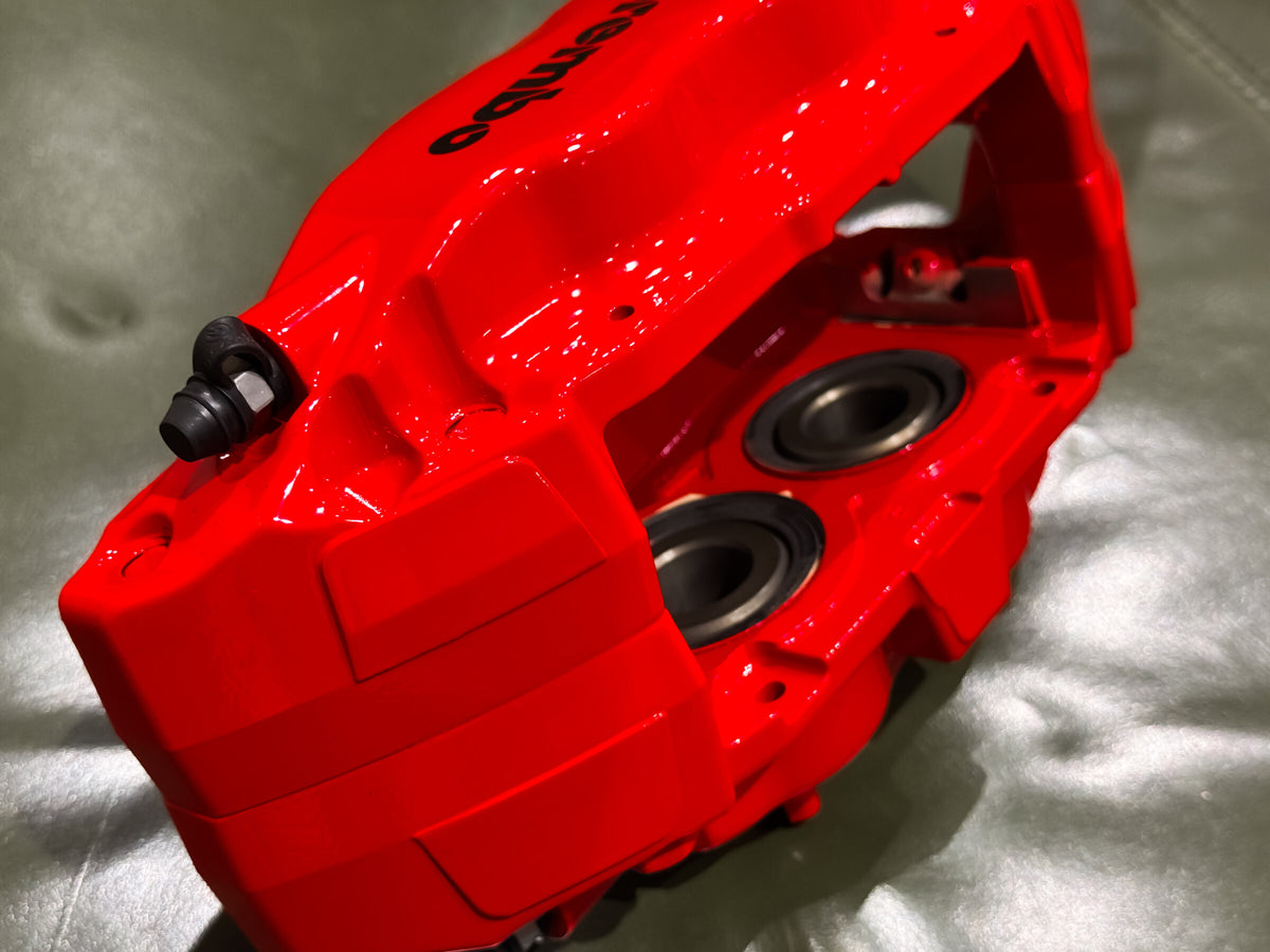 Piston side of the red Brembo F50 caliper after rebuild