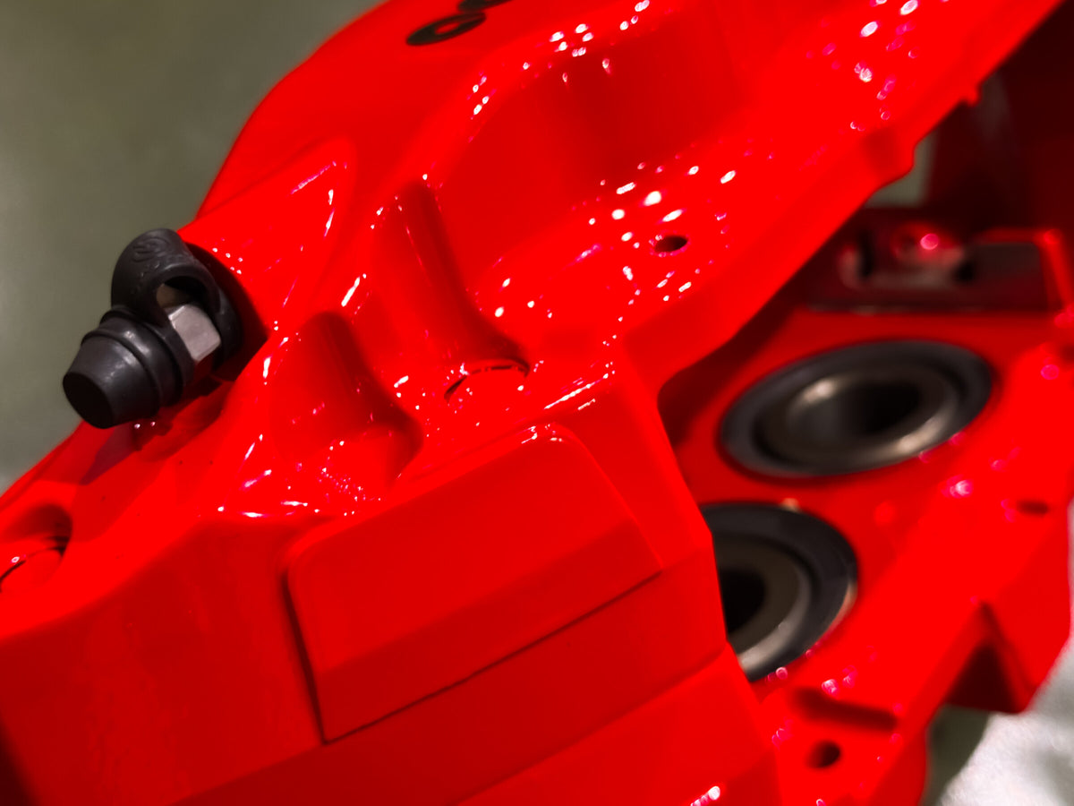Bleed nipple and caliper detail on the red Brembo F50