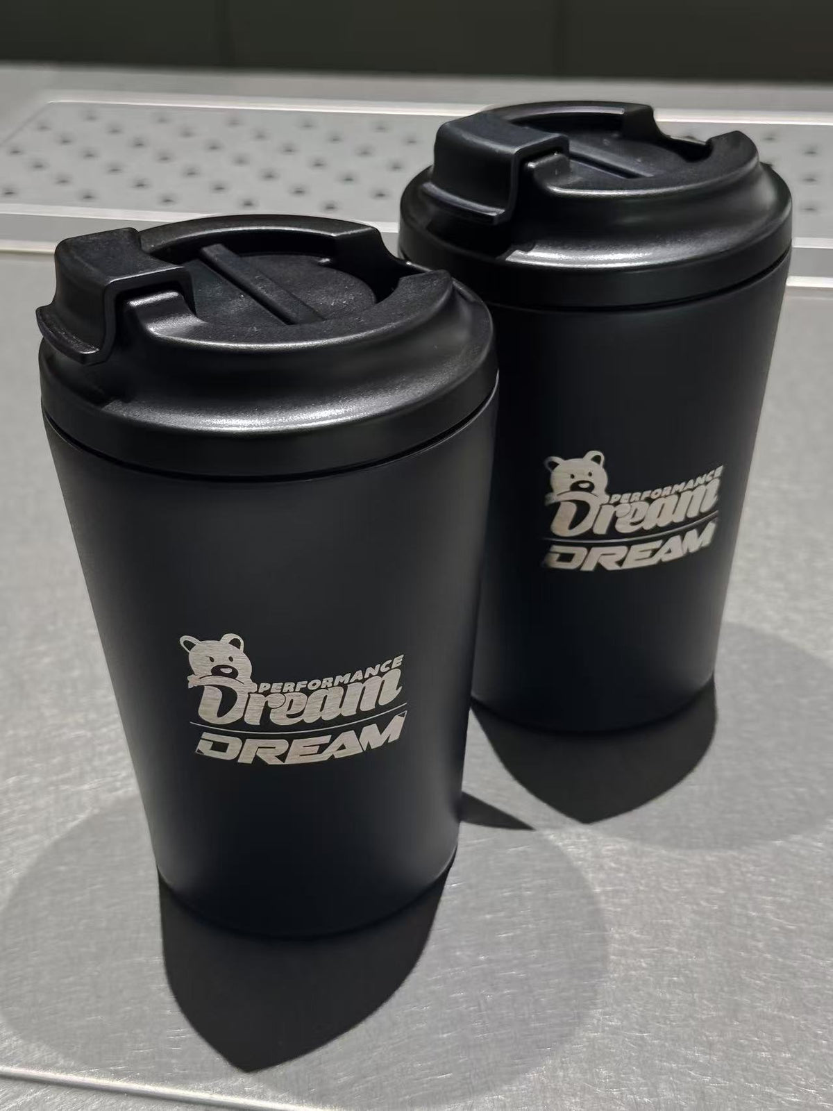 Two Dream Performance x Fressko coffee cups with click-back lids