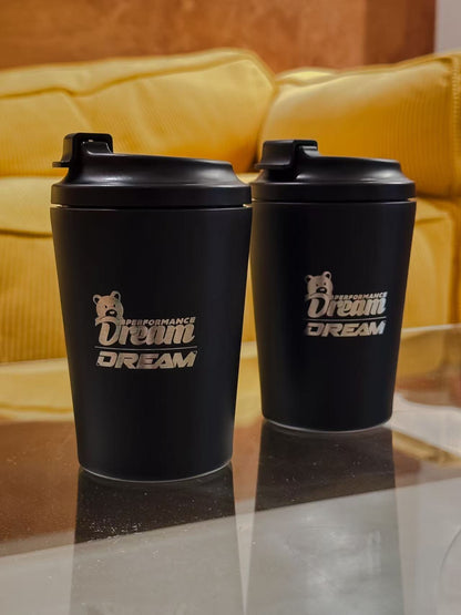 Pair of black Dream Performance x Fressko 12oz reusable coffee cups