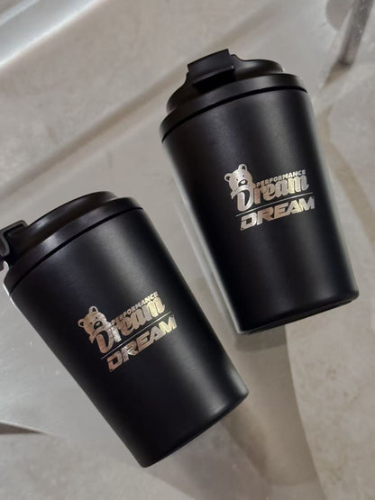 Dream Performance x Fressko coffee cups laid flat showing engraved logo
