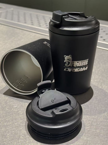 Dream Performance x Fressko coffee cup with click-back lid open