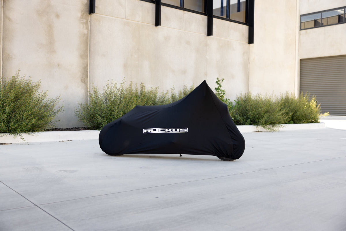 Honda Ruckus Zoomer NPS50 indoor bike cover in black with white RUCKUS lettering, side view