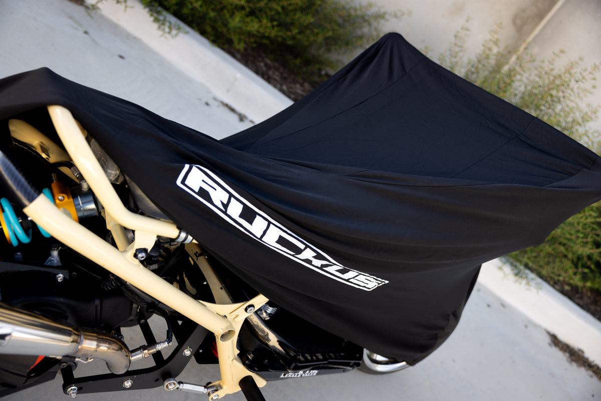Honda Ruckus NPS50 cover partly fitted over a custom frame