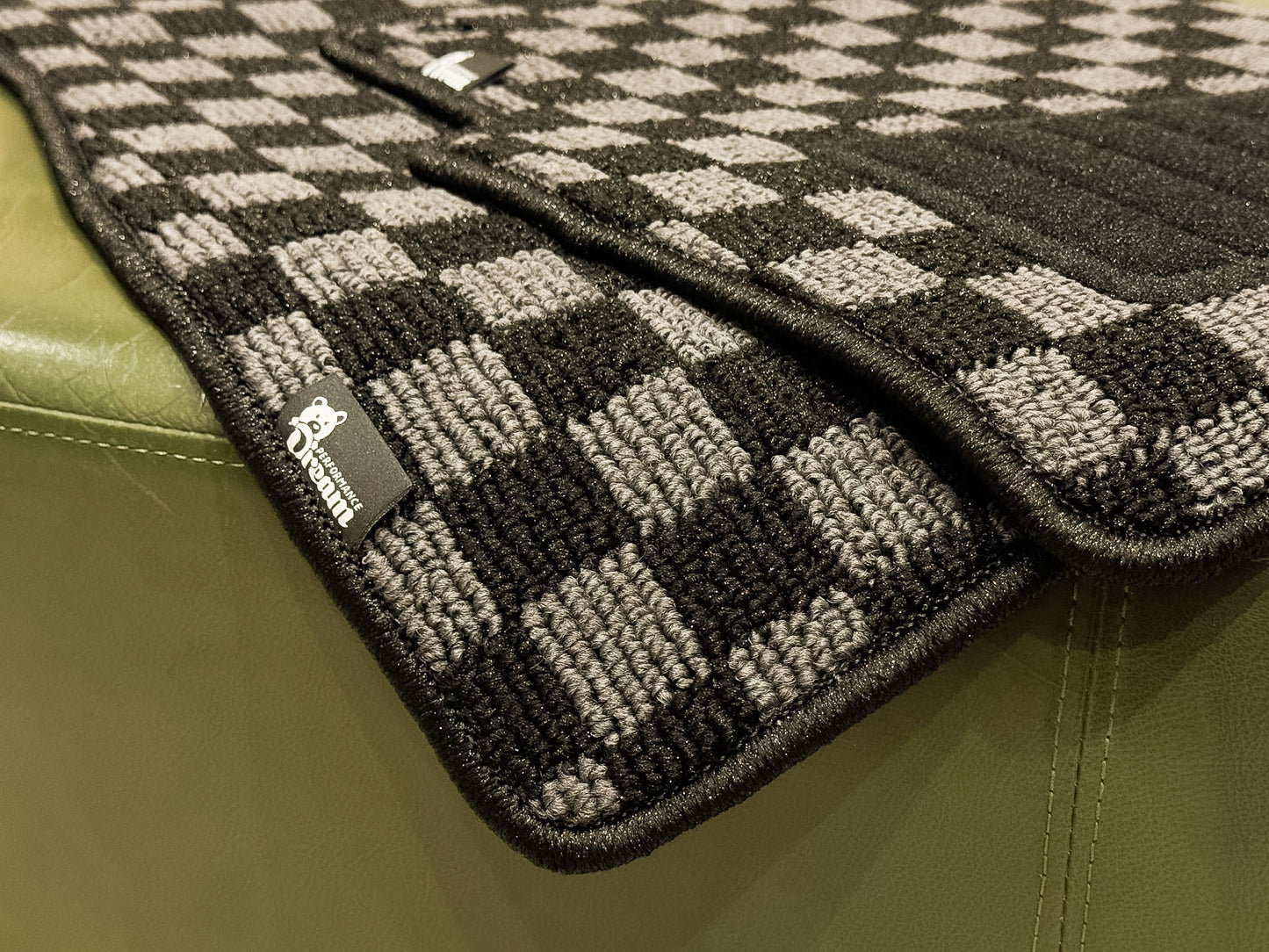 Checker floor mats photographed in natural light showing the high low loop pile