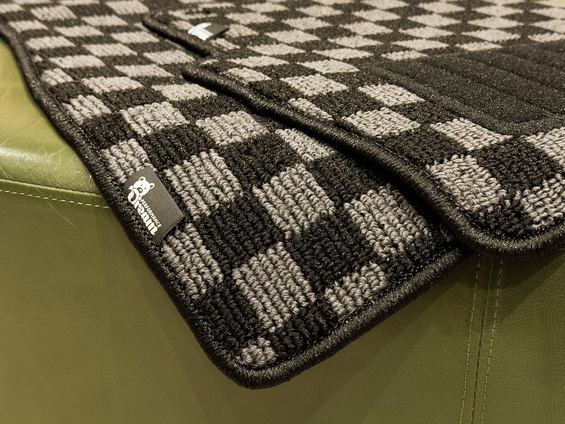 Checker floor mats photographed in natural light showing the high low loop pile