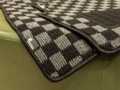 Checker floor mats photographed in natural light showing the high low loop pile