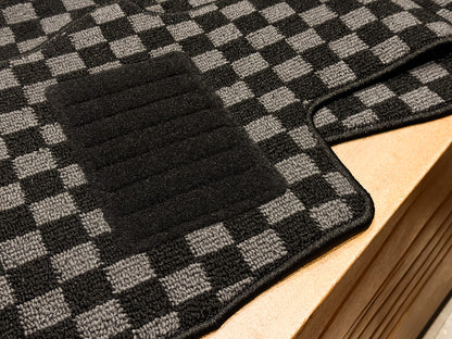 Driver side checker mat with nylon heel pad, shown from the front