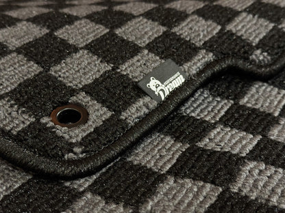 Close up of checker carpet weave, metal fixing eyelet and Dream Performance badge