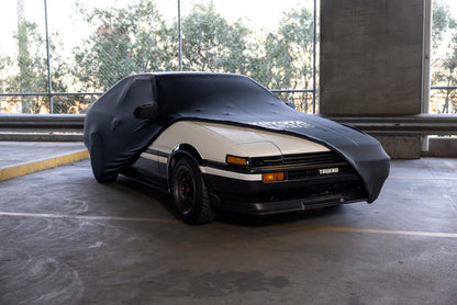 AE86 Trueno half covered, showing the indoor cover over the cabin and mirror