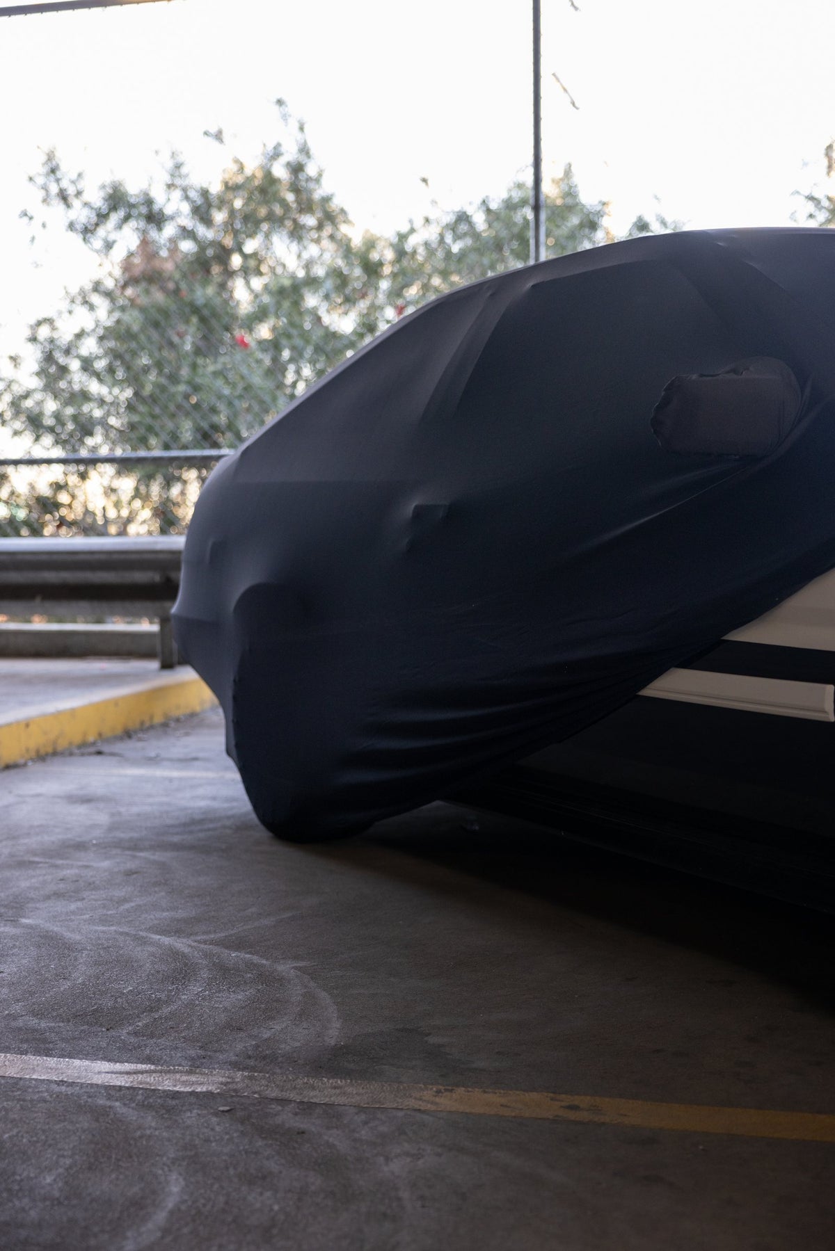 Rear corner of the AE86 Hachi Roku indoor car cover hugging the bodywork